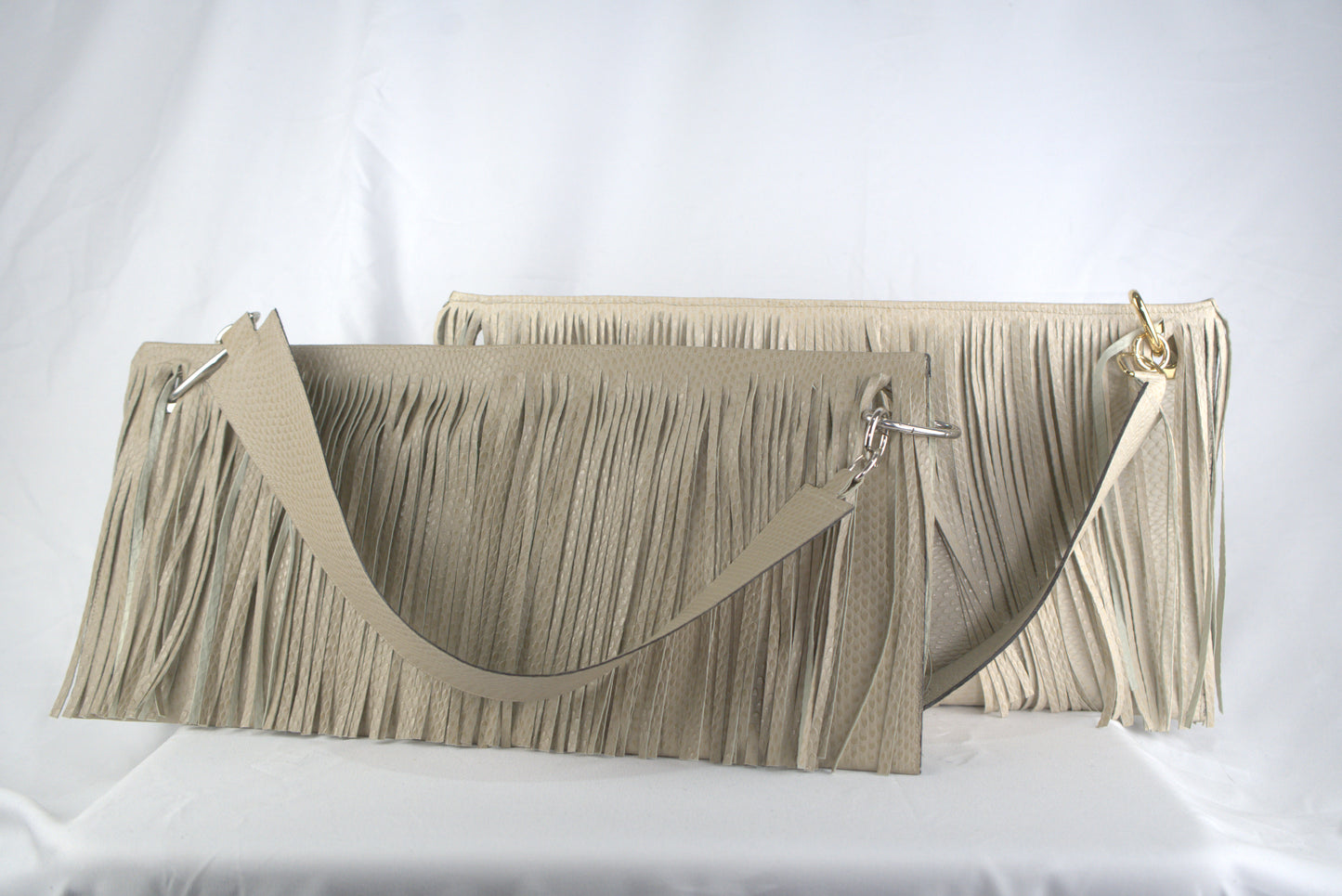 Borse rettangolari con frange in pelle stampa cobra